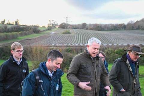 Secretary of State with Kent Wildlife Trust's Marc Crouch and farmers walking in Darent field