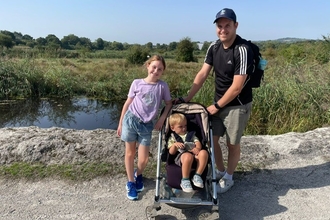 Paul Jobling and two young children (one in a push chair) at Holborough Marshes Nature Reserve