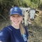 Jessica Allam, Wilder Grazing Ranger at KWT, stood with a longhorn cow.