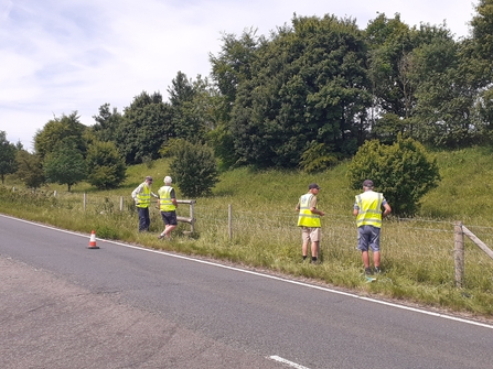4 Dover Volunteers repairing a fence