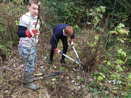 Oakley school nature heroes shrub clearing
