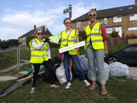 Members of transition dover after a litter pick holding up a sign saying Keep Kent CLean