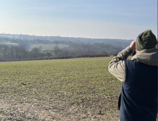 a person overlooking hoathly farm