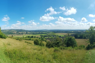 A panorama of Polhill Bank on a sunny day with blue skies.