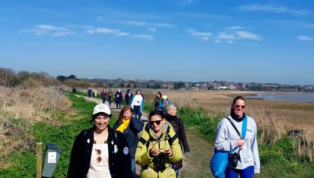 Women walking in the sunshine at Pegwell Bay