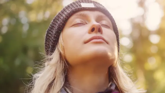 woman in a hat outside