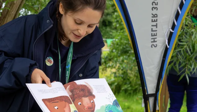 A person reading a storybook
