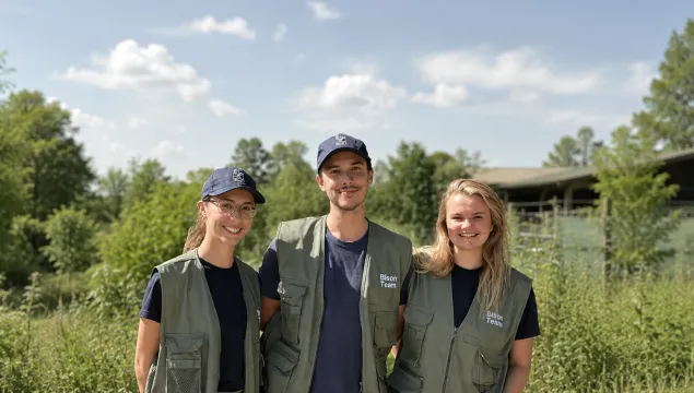 Heidi, Eddie, and Hannah, bison rangers standing in their uniforms.