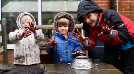 children playing with mud pies