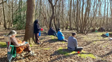 people sitting in the woods