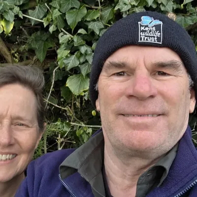 Liz & Steve Dallison, livestock checkers, smiling together in KWT uniform.