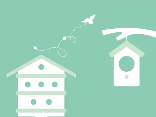 A bug hotel next to a hanging bird box