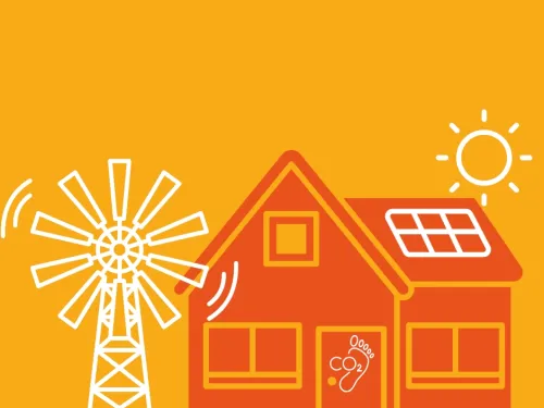 a windmill beside a house with a solar panel on it