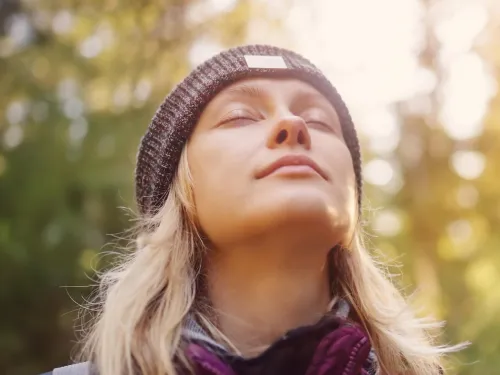 woman in a hat outside