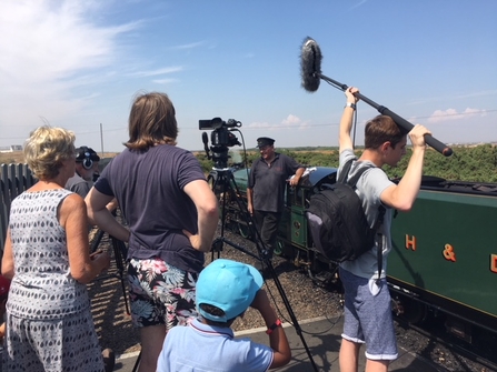 Filming at railway fifth continent volunteering 