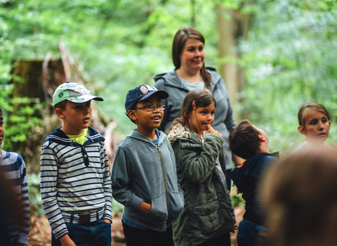 Children and families outdoors in woodland, photo by Helena Dolby for Sheffield & Rotherham Wildlife Trust