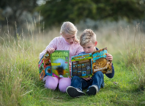 Children reading Wildlife Watch magazine - photo by Matthew Roberts